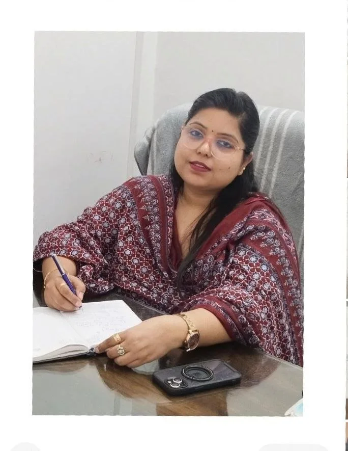 Dr. Roopali Bhatnagar seated at her desk